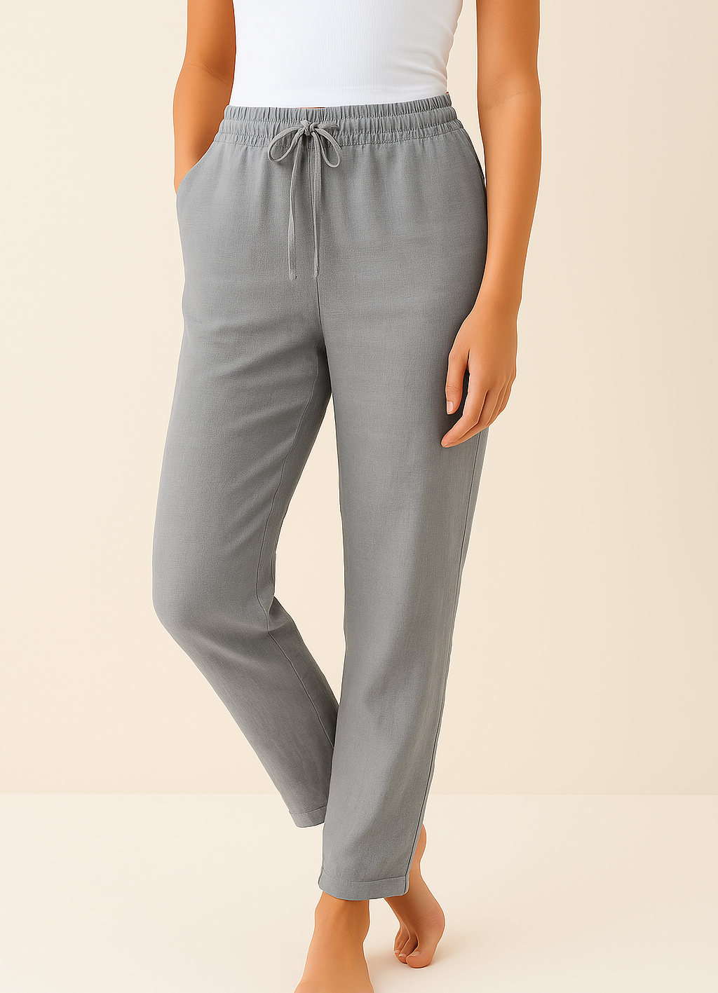 Gray wide-leg drawstring trousers with relaxed fit and cuffed hem