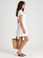 White eyelet mini dress with V-neck and short flutter sleeves, gathered waist