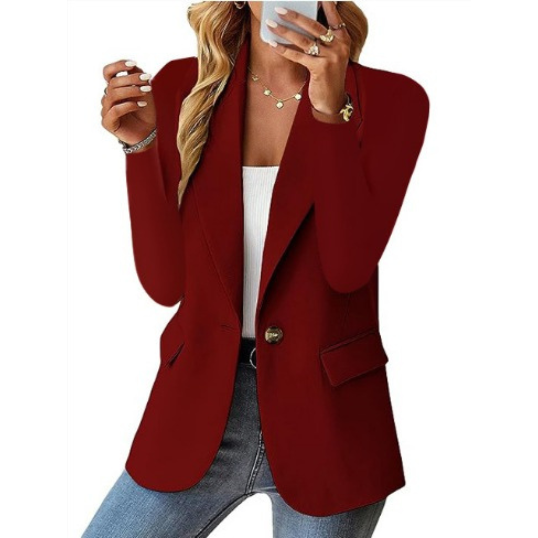 Burgundy tailored blazer with notched lapel, single button closure, and flap pockets