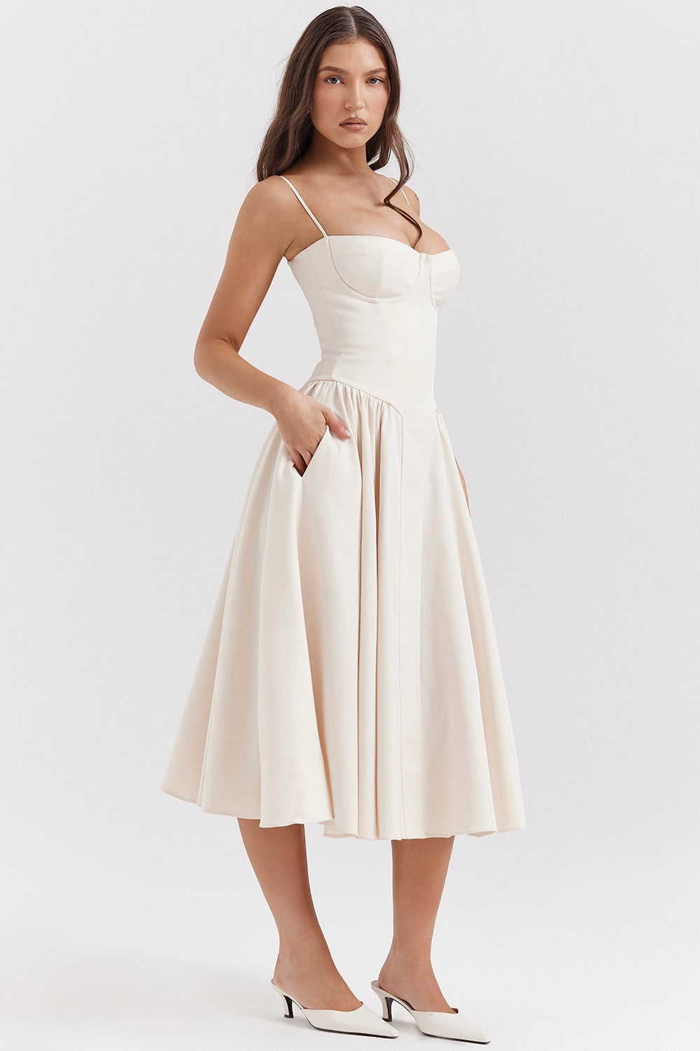 Light beige corset midi dress with sweetheart neckline, fitted bodice, and pleated skirt