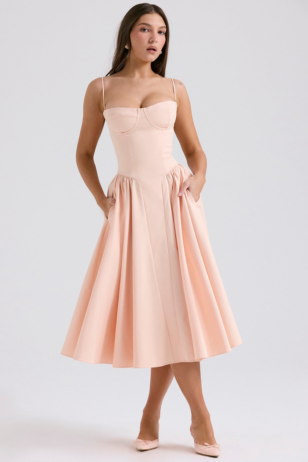 Light pink corset midi dress with sweetheart neckline, fitted bodice, and flared skirt