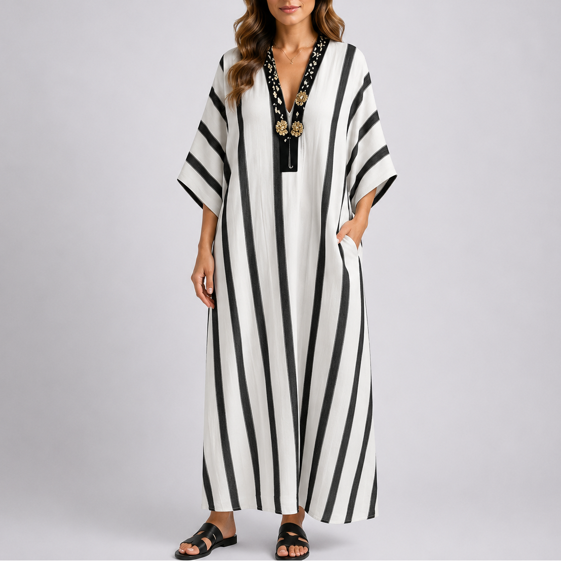 Kaftan maxi dress with black and white vertical stripes, V-neck and wide sleeves