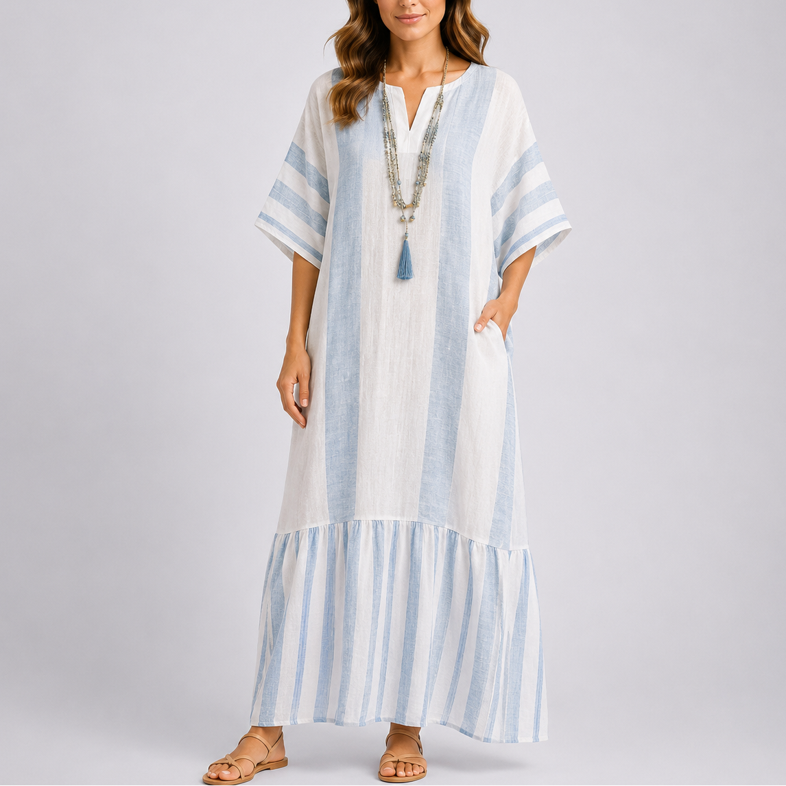 Kaftan maxi dress with light blue and white vertical stripes and tiered hem, V-neck