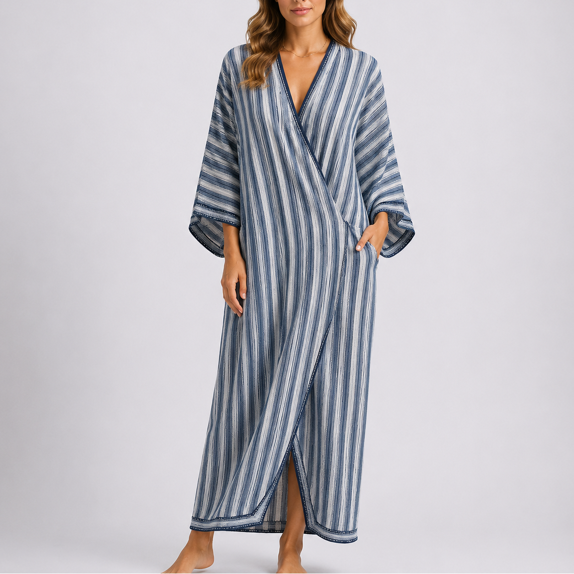 Kaftan maxi dress with blue and white vertical stripes, crossover V-neck and wide sleeves