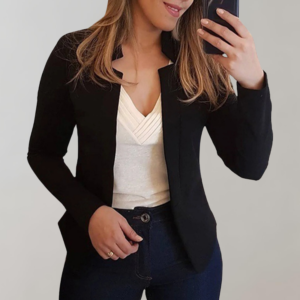 Black blazer with notched lapels and tailored fit, worn over a V-neck top