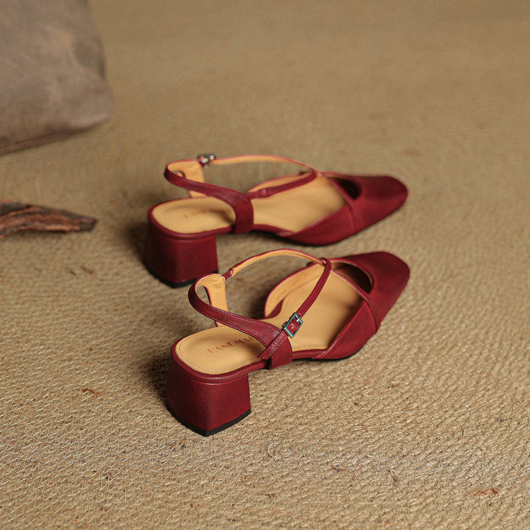 Red slingback heels with ankle strap buckle and mid block heel, side view