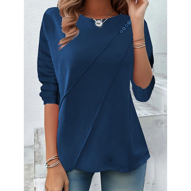 Blue draped button-detail top with diagonal wrap front and roll sleeves