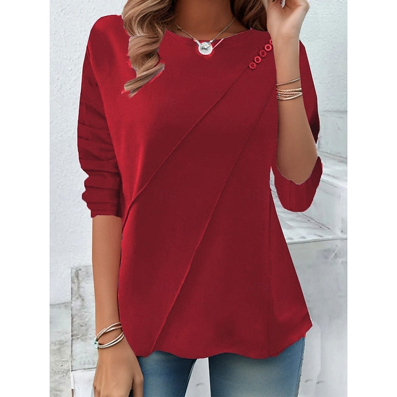 Red draped button-detail top with diagonal wrap front and roll sleeves