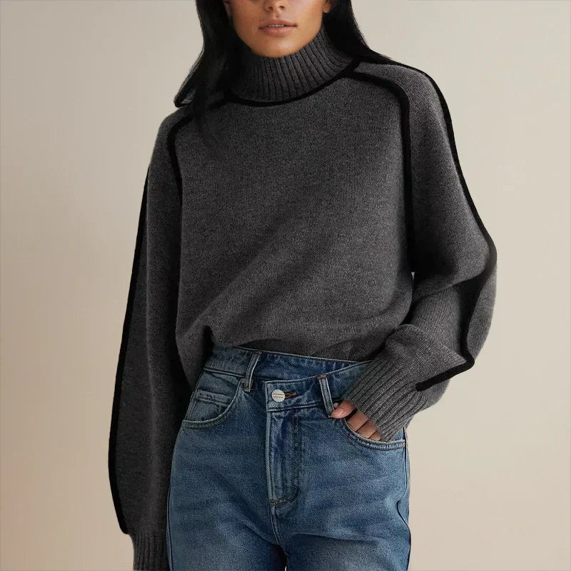 Oversized colorblock turtleneck sweater in charcoal gray with black contrast trim