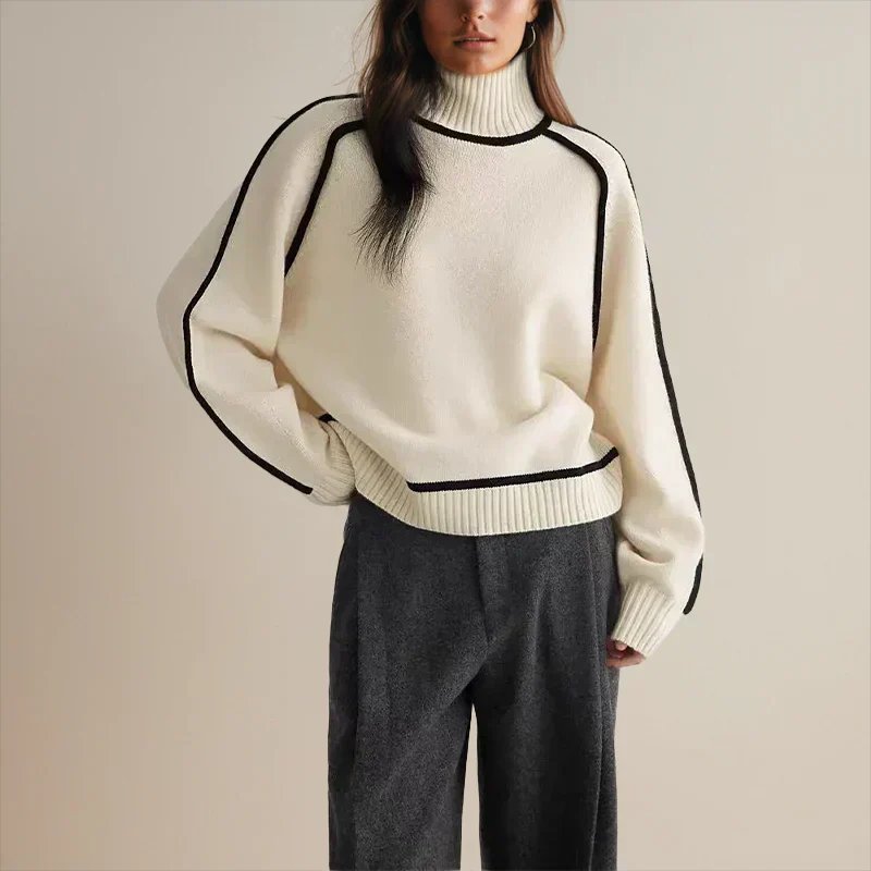 Oversized colorblock turtleneck sweater in white with black trim at collar and cuffs