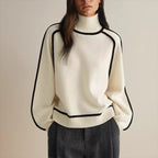 Oversized colorblock turtleneck sweater in cream white with black contrast trim