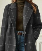 Women's grey plaid coat detail: button-front placket and notched lapels