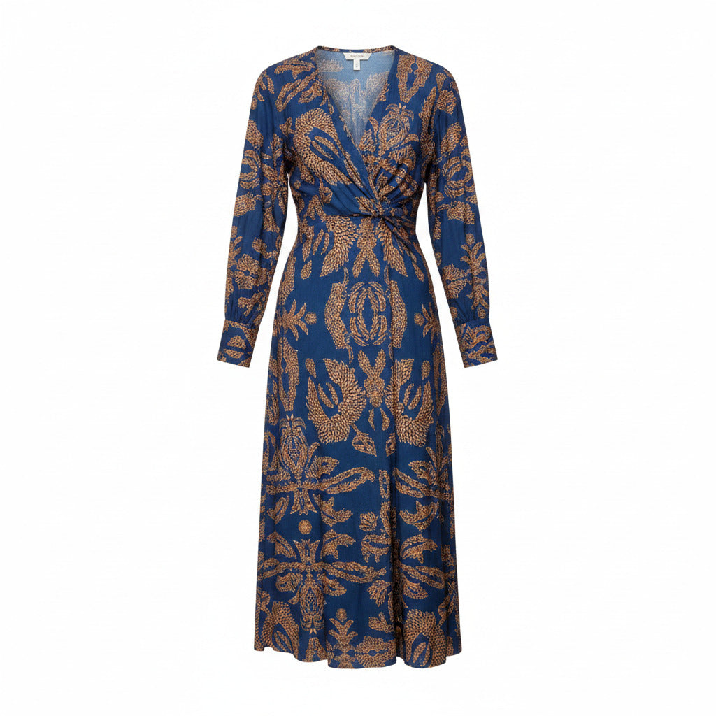 Back view of blue patterned midi dress with V-neck, long sleeves, and tie waist.