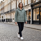 Women’s green quilted hooded down jacket, zip-front, worn with dark pants