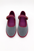 Gray suede-like Mary Jane flats with burgundy buckle strap, round toes, pair view.