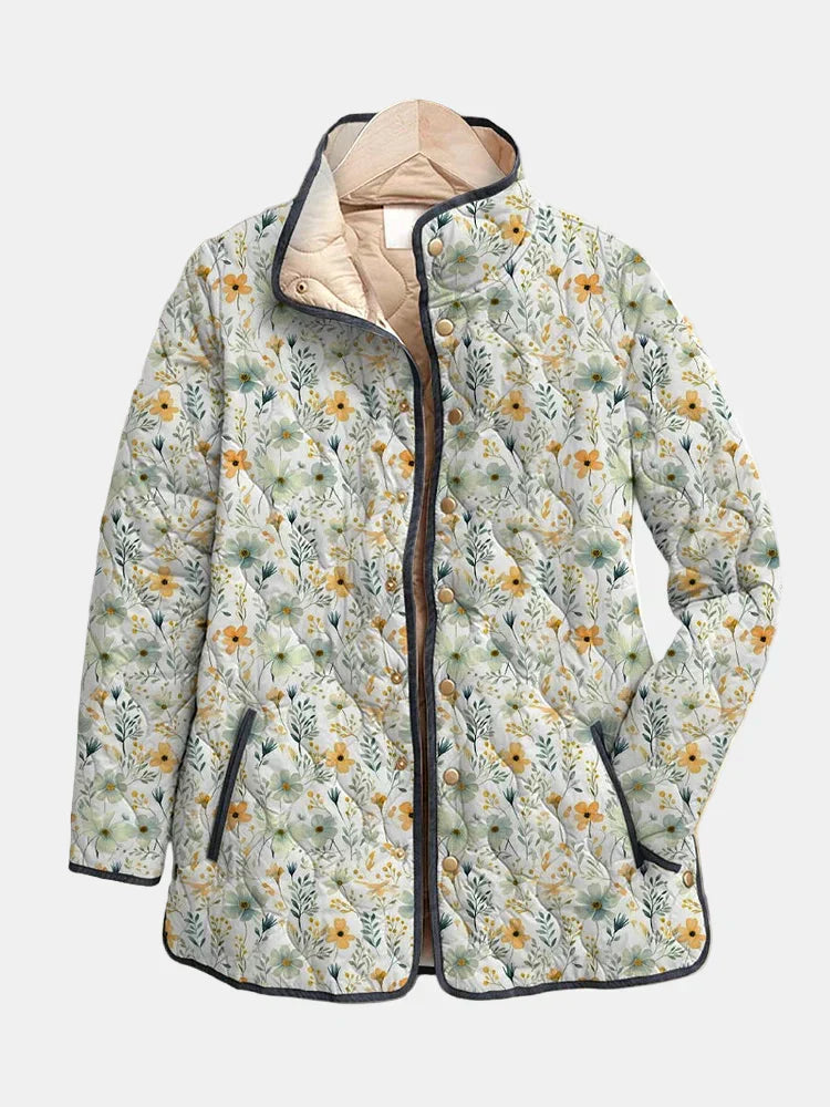 Quilted floral jacket with button front, hooded collar, and dark trim