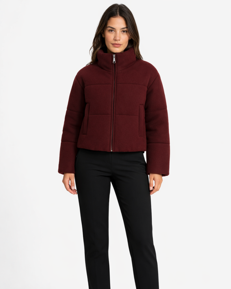 Dark red short puffer jacket with high neck, full-zip front, and side pockets.