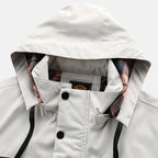 White jacket hood opening with plaid lining and snap button placket