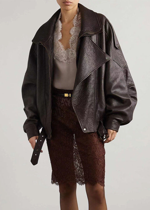 Women’s dark brown leather bomber jacket with sherpa lining and snap front