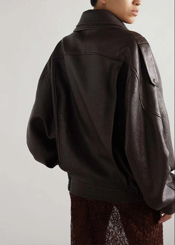 Women’s dark brown leather bomber jacket back view with high collar and seams