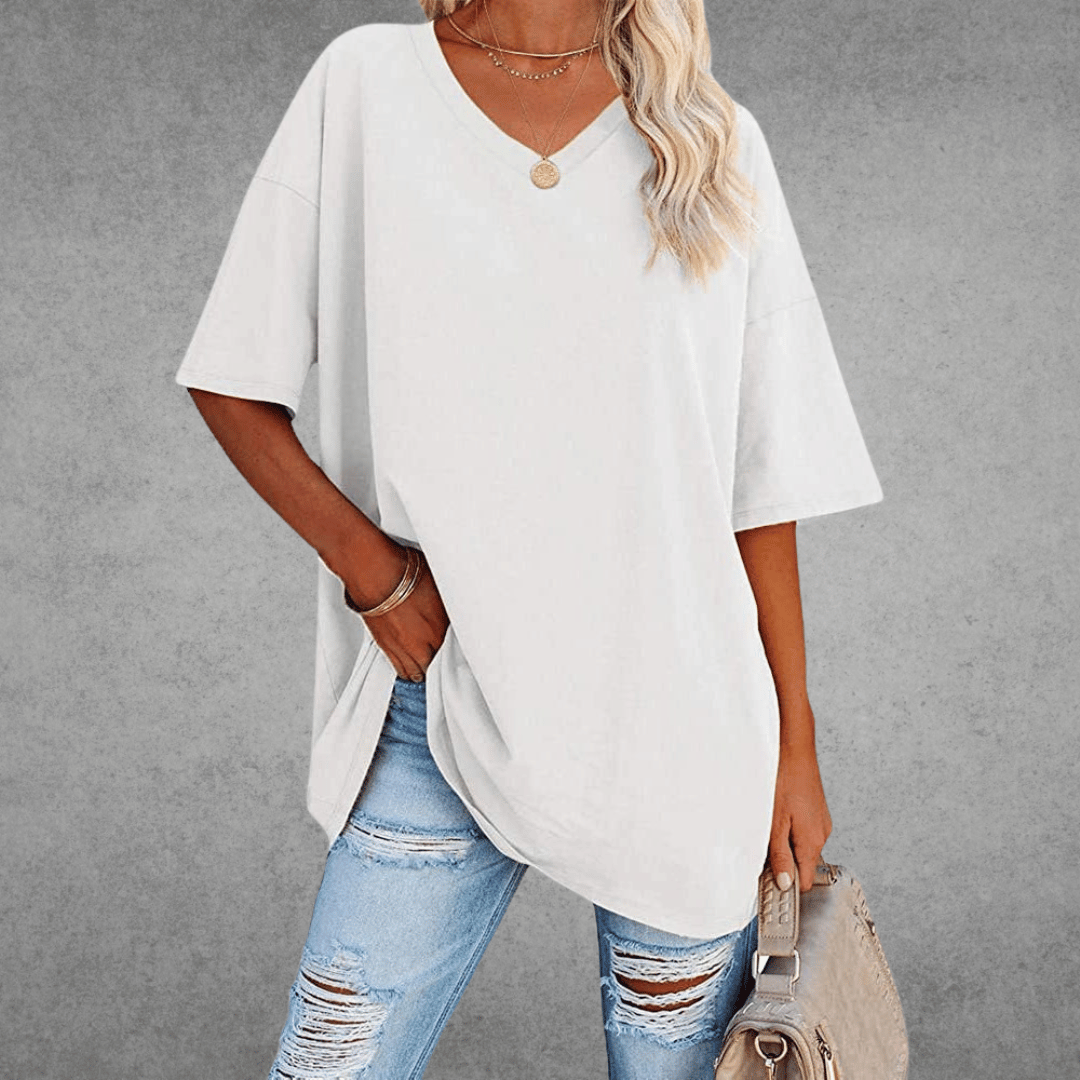 Women’s oversized V-neck T-shirt, white; loose fit short sleeves with front knot style hem.