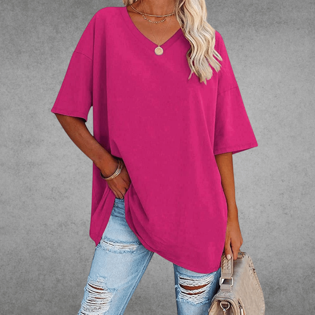 Women’s oversized V-neck T-shirt in hot pink with short sleeves and relaxed fit