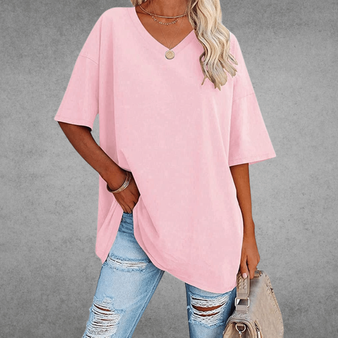 Women’s oversized V-neck T-shirt in light pink with short sleeves and relaxed fit