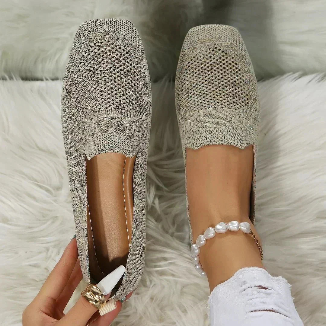 Beige perforated knit slip-on loafer flats with smooth flat sole