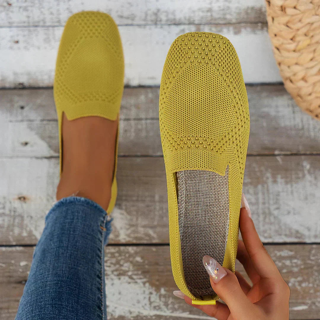 Yellow perforated knit slip-on loafer flats with low flat sole