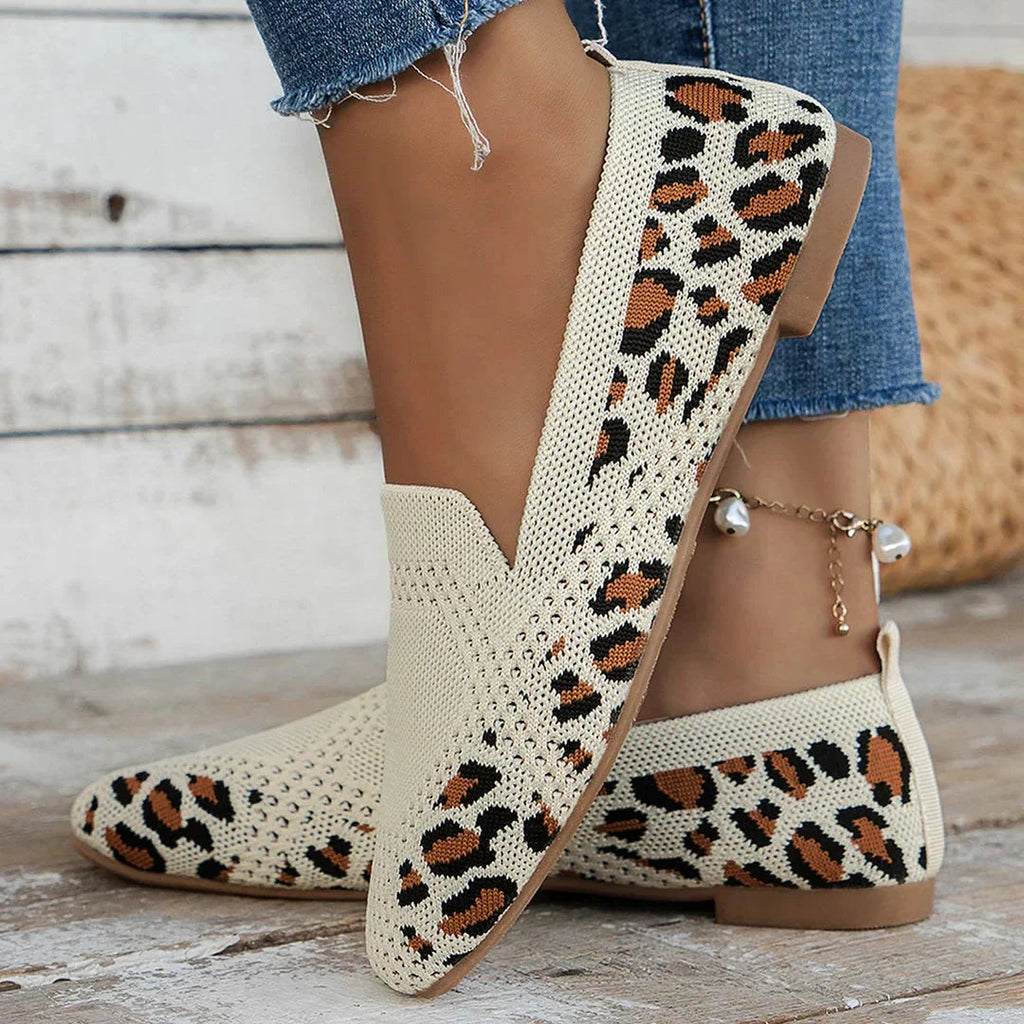 Cream perforated knit slip-on loafer flats with leopard-style multicolor print