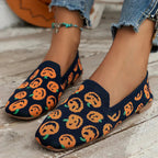 Navy perforated knit slip-on loafer flats with colorful pumpkin-style pattern