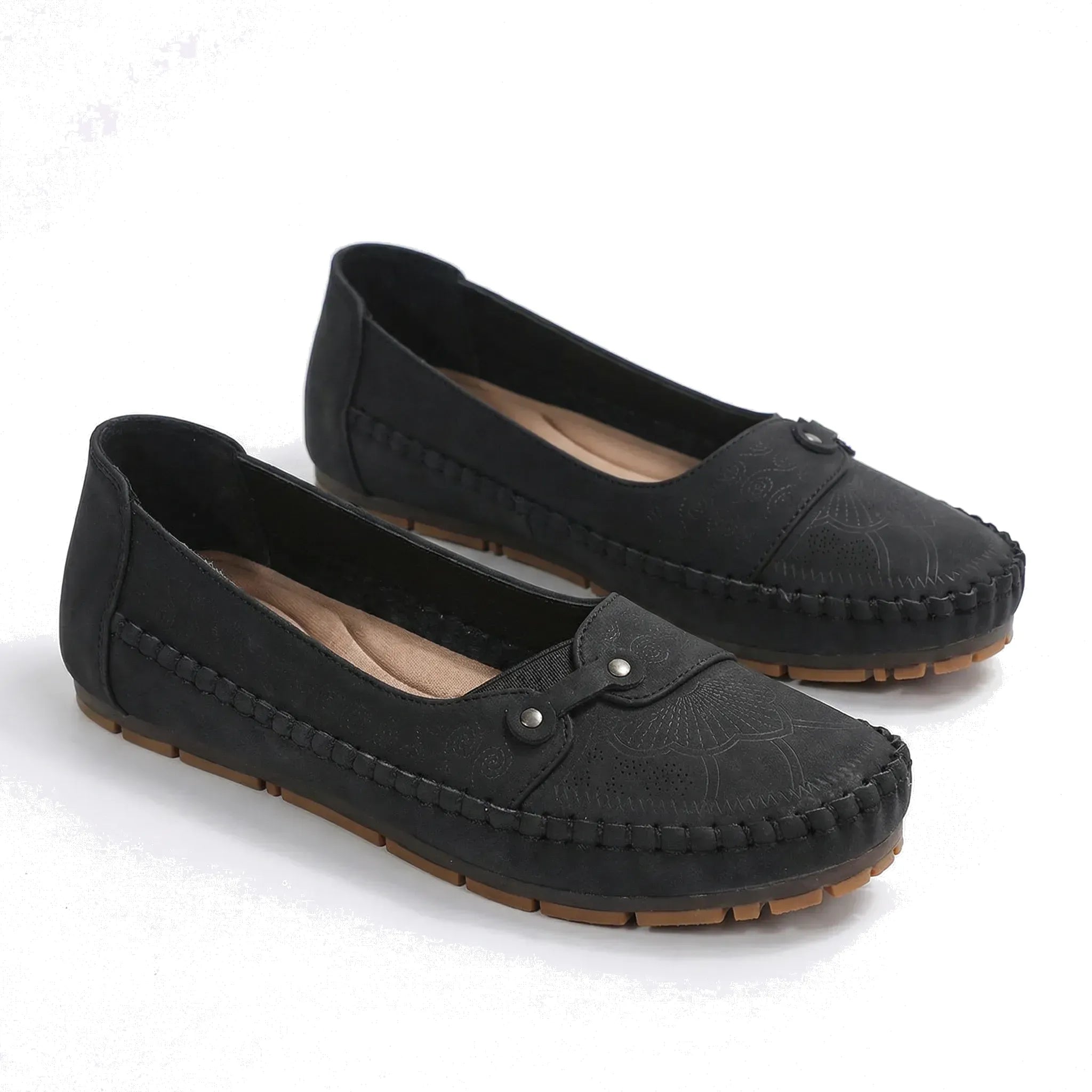 Black suede loafers with round toe, moc stitching, and hook-and-eye strap