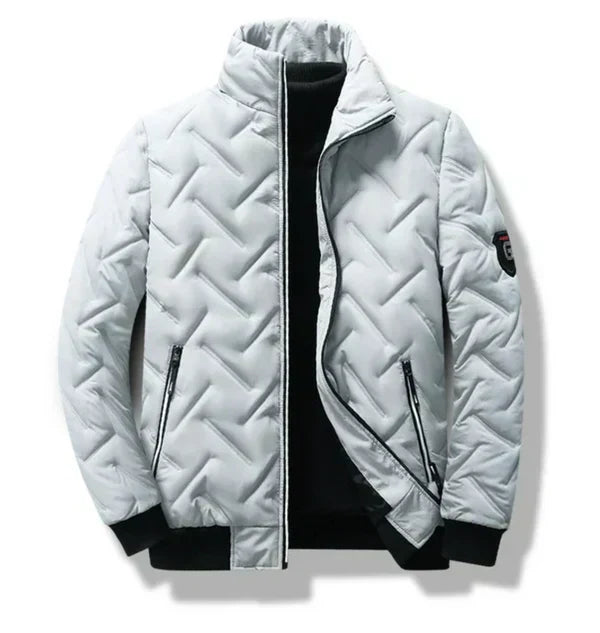 Light gray/white puffer jacket with chevron quilting, zip front, and two zip pockets.