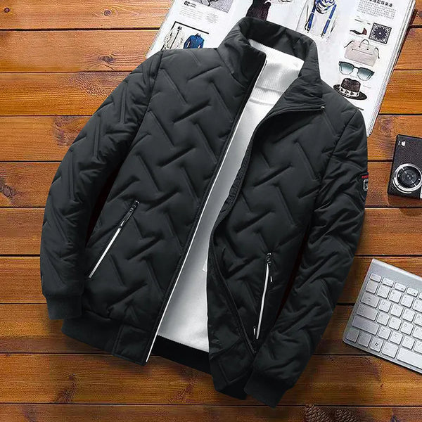 Black chevron-quilted puffer jacket with zip front, stand collar, and zip side pockets.