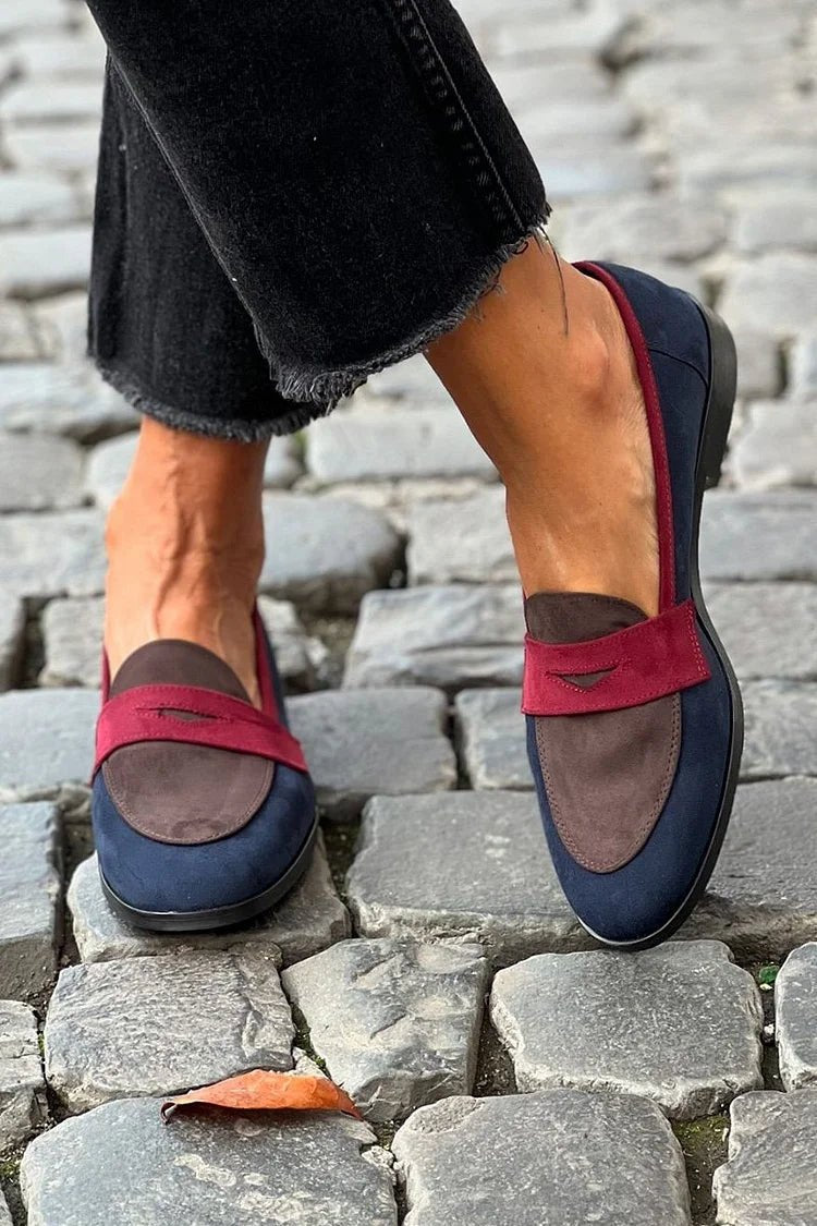 Women's navy slip-on loafers with red accent strap, rounded toe