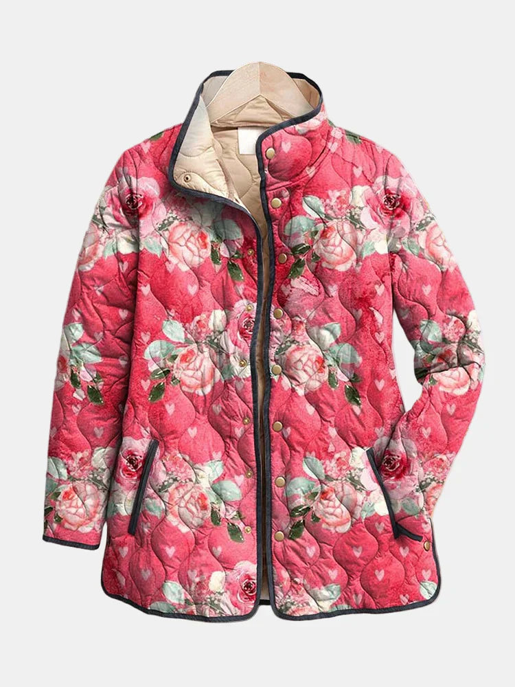 Pink floral quilted jacket with full zip, snap placket, and stand collar