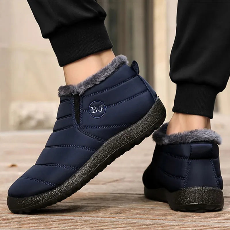 Winter slip-on boots in navy blue with gray faux-fur trim and cushioned outsole