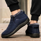 Winter slip-on boots in navy blue with gray faux-fur trim and cushioned outsole