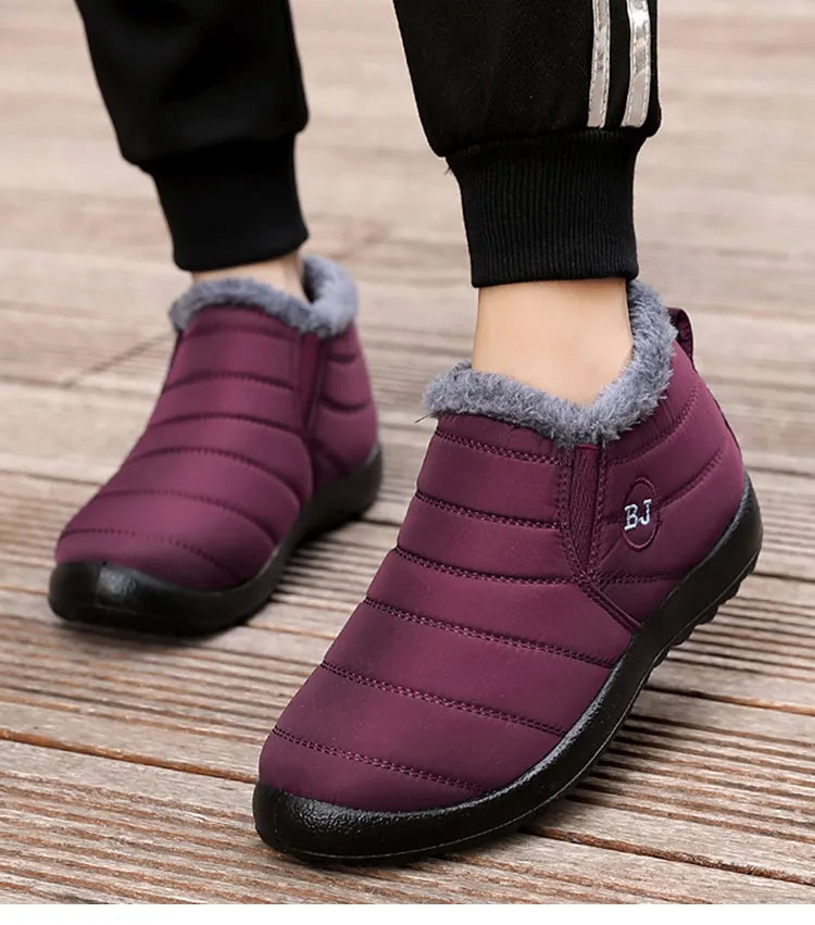 Burgundy winter slip-on boots with gray faux-fur collar and thick black rubber sole