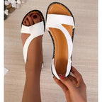 White wide-fit flat sandals with open asymmetric upper and cutout strap