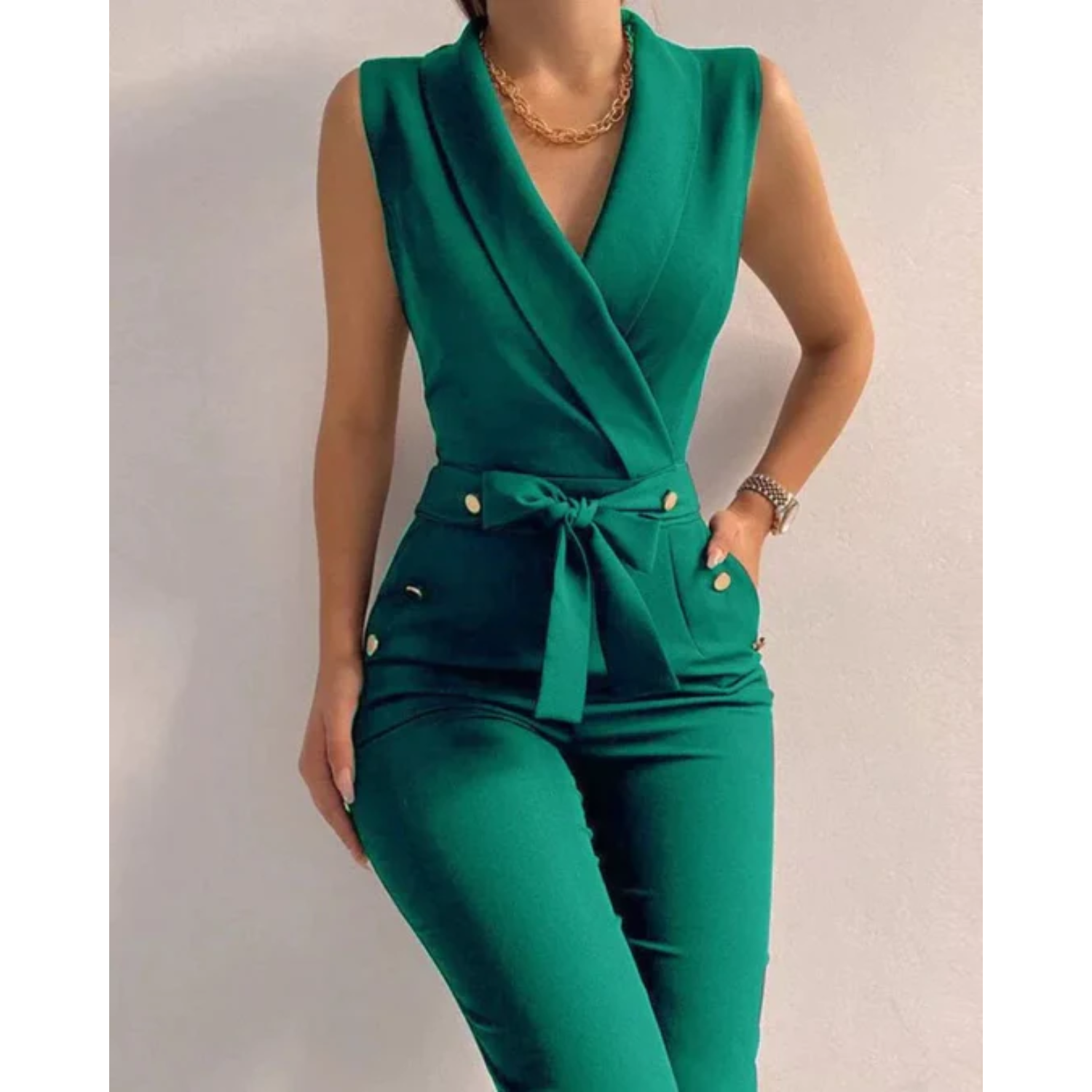 Women's green sleeveless wrap jumpsuit, tied waist, decorative button pocket details