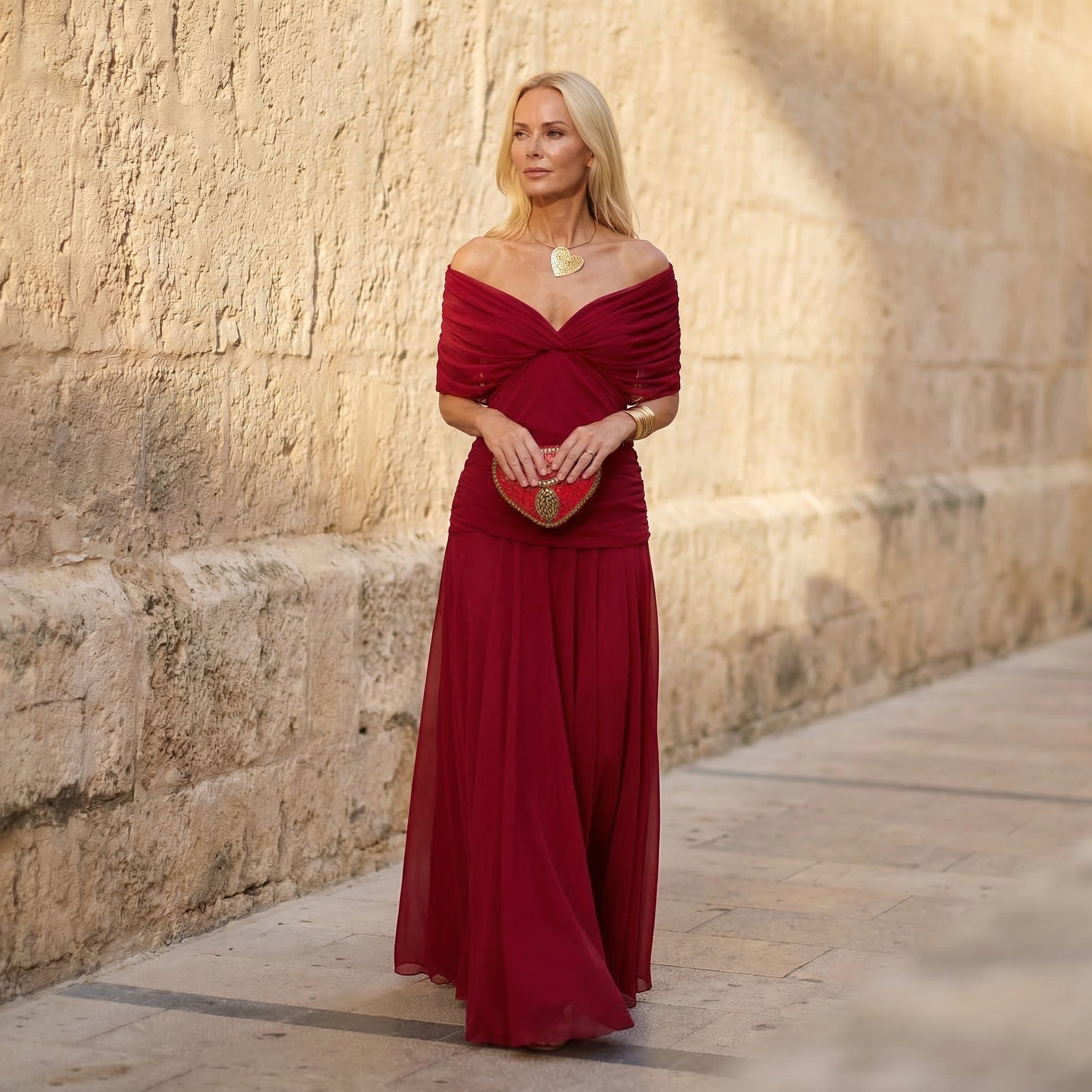 Red off-shoulder pleated maxi dress with ruched draped bodice