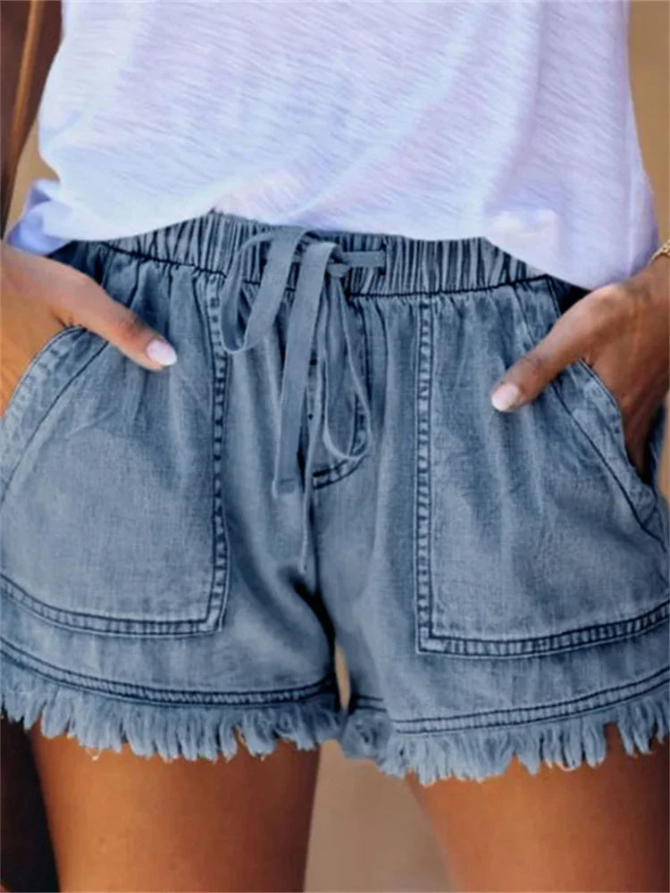 Dark blue denim shorts with drawstring waist, frayed hem, and front cargo pockets