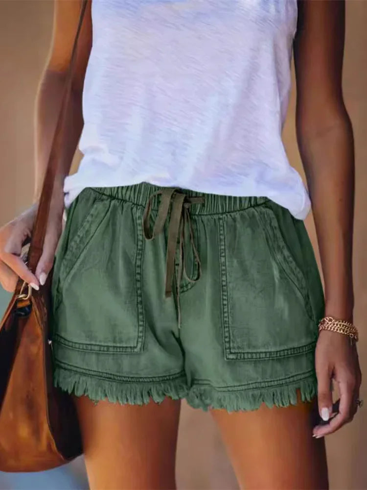 Green denim summer shorts with drawstring waist, frayed hem, and front cargo pockets