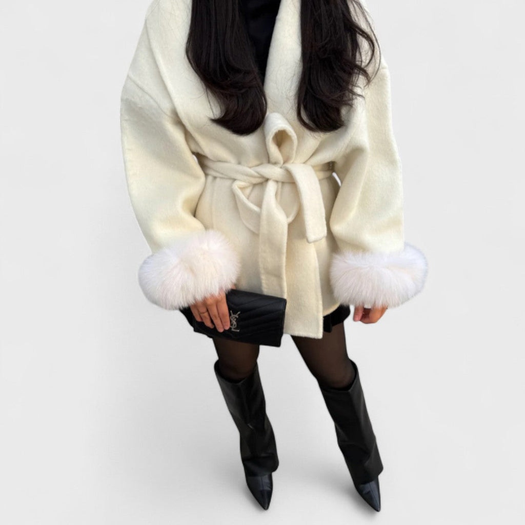 White elegant coat with tied waist belt and faux fur trim at cuffs