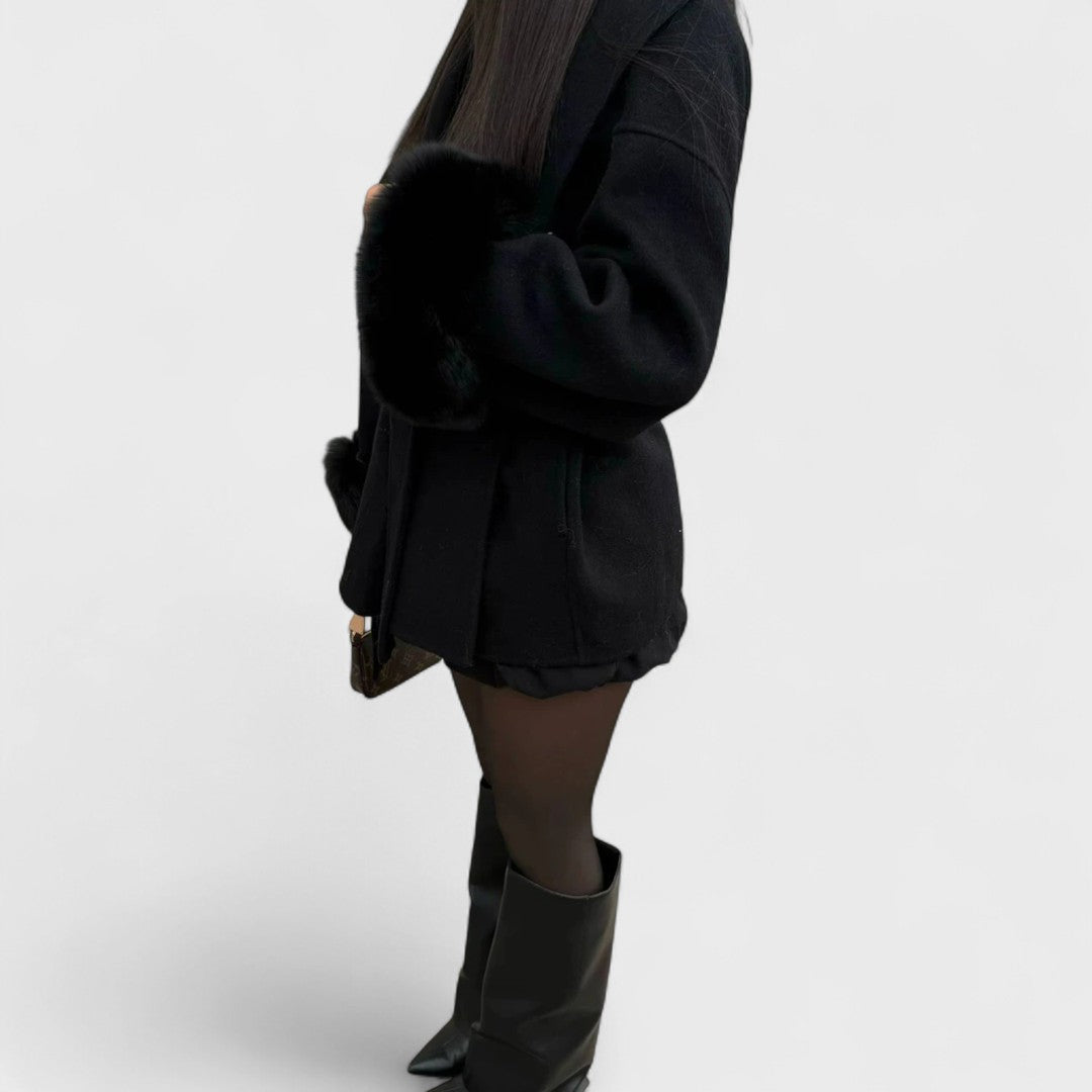 Black coat with faux fur cuff trim and short, tailored silhouette