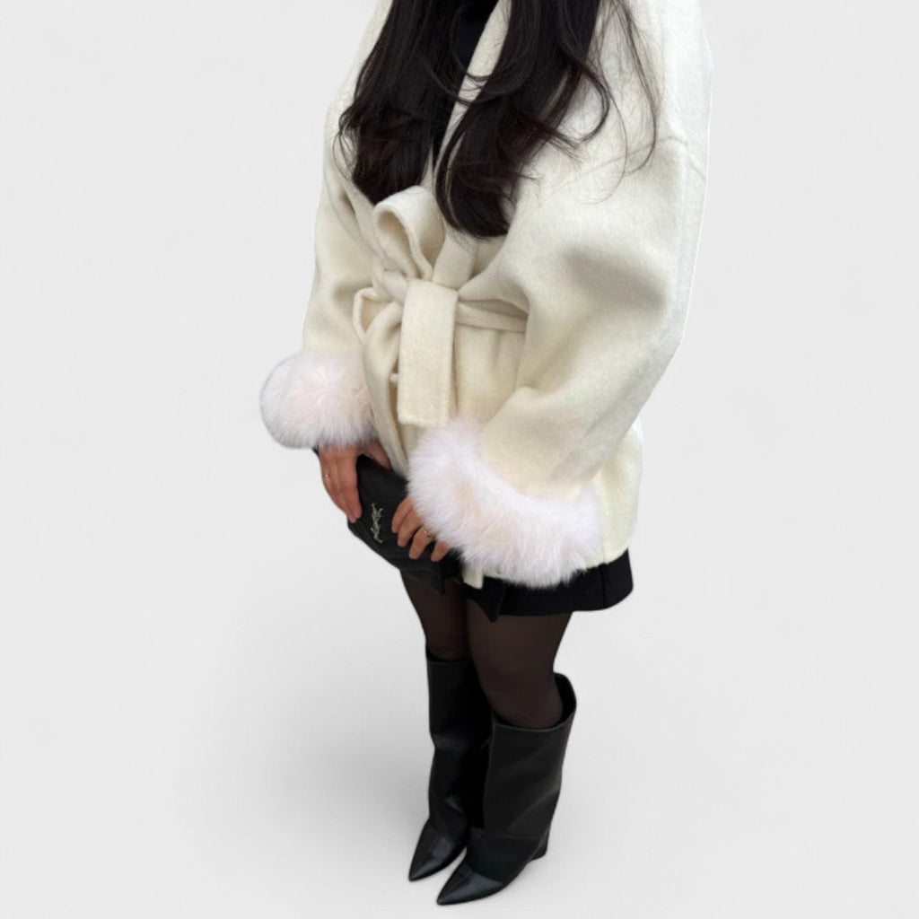 White coat with tied waist ribbon and faux fur cuffs