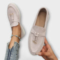 Women's beige suede slip-on loafers with bowknot detail and metal loops