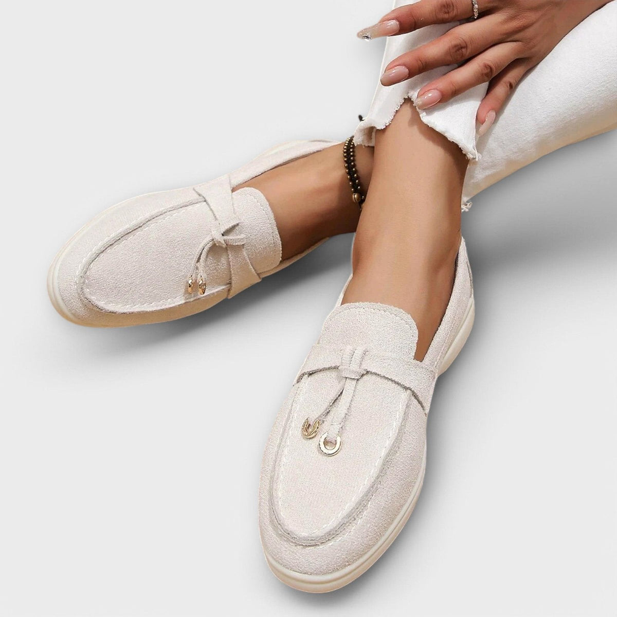 Women's light beige suede slip-on loafers with bowknot strap and metal rings