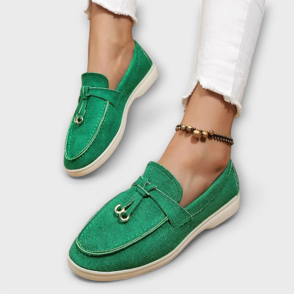 Women's green suede slip-on loafers with bowknot vamp detail and metal loops